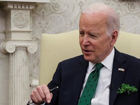 U.S. President Joe Biden speaks while hosting a virtual St. Patrick's Day meeting with Ireland's Prime Minister Micheal Martin in the Oval Office at the White House in Washington, D.C., on March 17, 2022.