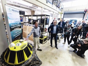 Project manger Dr. Ben Whitby with Pacific Regional Institute for Marine Energy Discovery (PRIMED) describes a Triaxys directional wave buoy at a funding announcement at the University of Victoria Marine Technology Centre Thursday. DARREN STONE, TIMES COLONIST