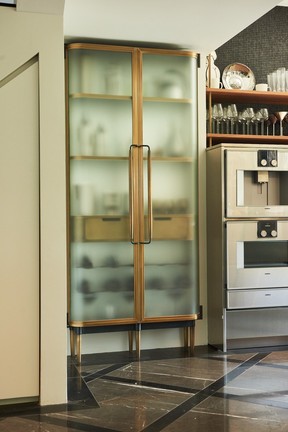 Curved glass Plano Bar cabinet by Vancouver's New Format Studio.