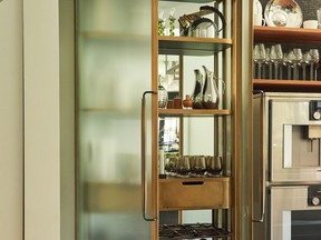 Curved glass Plano Bar cabinet by Vancouver's New Format Studio.