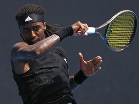 Mikael Ymer of Sweden plays a forehand return to Yoshihito Nishioka of Japan during their first round match at the Australian Open.