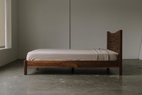 Whim bed made from solid walnut.