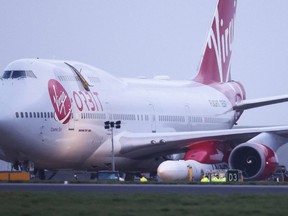 Cosmic Girl, a Virgin Boeing 747-400 aircraft sits on the tarmac with Virgin Orbit's LauncherOne rocket attached to the wing, ahead of the first UK launch at Spaceport Cornwall at Newquay Airport in Newquay, Britain, January 9, 2023.
