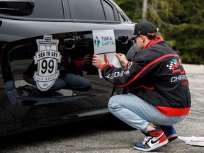 ALS Sea-to-Sky Rally founder Aidan Bate-Smith gets a car ready for the rally at Cypress.