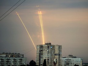 Russian rockets launch against Ukraine from Russia's Belgorod region are seen at dawn in Kharkiv, Ukraine, Monday, Aug. 15, 2022.