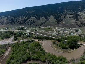 The swollen Bonaparte River runs through the Bonaparte First Nation north of Cache Creek on May 14, 2023.