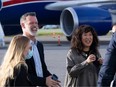 Actor Sandra Oh and former Olympian Mark Tewksbury wait to board a government plane as part of the Canadian delegation for the queen's state funeral, Sept. 2022.