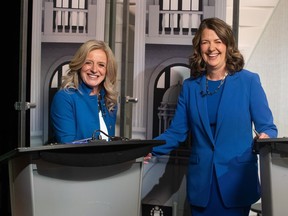 Leader of the NDP Rachel Notley, left, and Leader of the United Conservative Party Danielle Smith shake hands before a debate in Edmonton on Thursday, May 18, 2023.