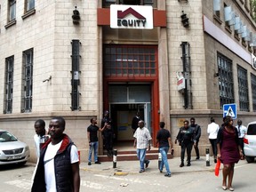Pedestrians walk outside an Equity Bank, Kimathi street branch in Nairobi, Kenya, May 16 2023.