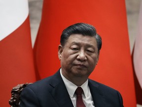 Chinese President Xi Jinping gives a joint press conference with France's President Emmanuel Macron at the Great Hall of the People in Beijing, China, Thursday, April 6, 2023. The head of a Vancouver-based group that says it is a "non-political" organization helping Chinese integrate into Canadian society travelled to Beijing to meet President Xi Jinping at a government conference this week.