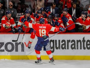 Florida Panthers left wing Matthew Tkachuk (19) celebrates with teammates after scoring the game-winning goal against the Carolina Hurricanes during the third period in game four of the Eastern Conference Finals of the 2023 Stanley Cup Playoffs at FLA Live Arena.