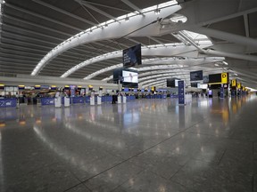FILE - Terminal 5 at Heathrow Airport in London, which handles British Airways flights, stands virtually empty of passengers as staff standby to help during a British Airways pilots' strike, Monday, Sept. 9, 2019. British Airways cancelled dozens of flights on Friday, May 26, 2023, due to computer problems, disrupting the plans of thousands of travelers at the start of a busy holiday weekend.