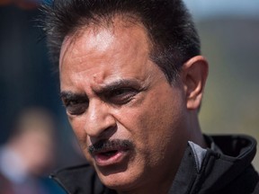 Former New Democrat cabinet minister Harry Lali says he is joining the Opposition BC United, saying his former party no longer champions rural British Columbia. Lali attends a campaign stop with Leader John Horgan outside the closed Tolko Industries Nicola Valley sawmill in Merritt, B.C., on Tuesday May 2, 2017.