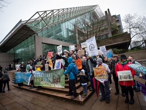 Members of the Nuchatlaht First Nation and supporters rally outside B.C. Supreme Court before the start of an Indigenous land title case, in Vancouver, on Monday, March 21, 2022. A British Columbia Supreme Court judge says the First Nation did not prove it had rights to its entire claim area, although he suggested it may be time for the provincial government to rethink its current test for such titles.