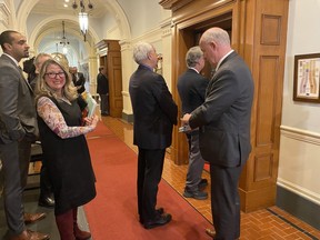 NDP cabinet ministers, from left, Ravi Kahlon, Lana Popham, Murray Rankin and Mike Farnworth wait to enter the House on final day of the spring sitting at the B.C. legislature in Victoria on Thursday, May 11, 2023.