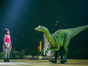 NiaImani Cooper-Parker as Alison Hughes with Jeanie the dinosaur in Jurassic World Live Tour.
