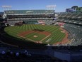 People watch a baseball game at Oakland Coliseum between the Oakland Athletics and the Texas Rangers in July of 2022.