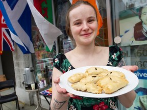 Amy Bird of the British and Irish grocery store Celtic Treasure Chest, gets ready for a coronation party with home-made pasties at the store in Vancouver, B.C. Saturday, May 6, 2023. Charles III was officially crowned King of England Saturday. (Photo by Jason Payne/ PNG)
