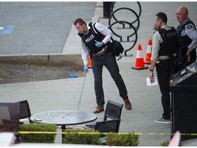 Coquitlam RCMP investigate a shooting that occurred at approximately 7pm outside Hiraku Sushi at Coast Meridian Road and David Avenue in Coquitlam, BC Wednesday, May 17, 2023.