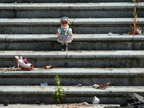 FILE PHOTO: Hundreds of pairs of children’s shoes placed in a memorial to the students of B.C.’s residential schools on the steps of the Vancouver Art Gallery.