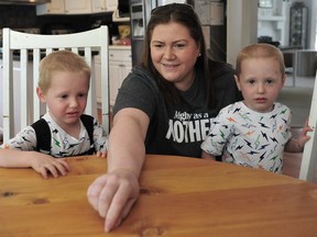 Alisha Openshaw and her identical twin sons Weston (left) and Bennett who were diagnosed with the same cancer last year within four months of each other.