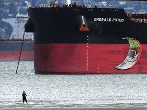 A wind surfer in action during low tide at Spanish Banks Beach in Vancouver on May 22, 2023.