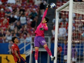 Vancouver Whitecaps goalkeeper Yohei Takaoka (18) attempts to make a save in the first half against FC Dallas at Toyota Stadium.
