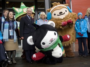 Then Prince Charles (left) and Her Royal Highness Camilla, Duchess of Cornwall, pose for a photo with the Vancouver 2010 Mascot Sumi (back) Miga (centre) and Quatchi while on a touring the Athlete's Village for the Vancouver 2010 Winter Olympics on Nov. 7, 2009.