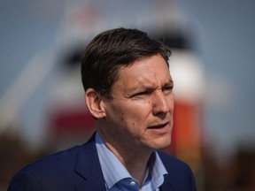British Columbia Premier David Eby speaks during an announcement at the Seaspan Ferries Tilbury Terminal in Delta, B.C., on Thursday, April 27, 2023. Eby says he expects the province and Surrey's mayor and council to work together to resolve the police service issue in the Metro Vancouver city.