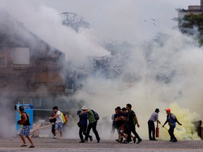 People take part in an annual civilian defence drill outside Taipei City Hall earlier this month, which this year focuses on the response from various agencies and volunteer groups if under attack by China.