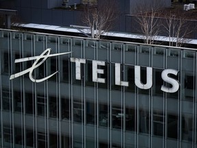 The Telus Corporation logo is seen on the outside of the company's headquarters in downtown Vancouver, B.C., Thursday, Jan. 19, 2023. Telus reported its earnings for the latest quarter.