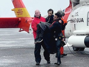 A man, later identified as Jericho Wolf Labonte of Victoria, is taken off a U.S. Coast Guard helicopter in February after being rescued from the mouth the Columbia River. He had fallen into rough seas when the stolen yacht that he was aboard was flipped by a huge wave.