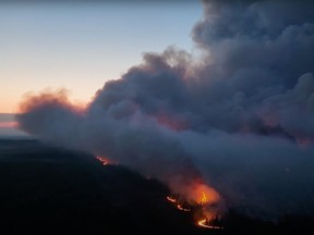 Smoke is shown as the Stoddart Creek wildfire burns in British Columbia in this May 14, 2023 handout image taken from video.
