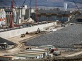 A partially completed section of the Site C approach channel lining, with riprap cover and granular fill. The approach channel will funnel water from the main reservoir to the powerhouse.