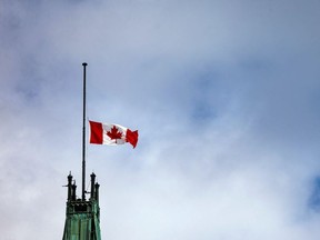 The Canadian flag at half mast above the Peace Tower on Parliament Hill, Monday, September 13, 2021. ASHLEY FRASER, POSTMEDIA