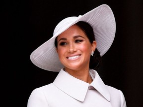 Britain's Meghan, Duchess of Sussex, smiles at the end of the National Service of Thanksgiving for The Queen's reign at Saint Paul's Cathedral in London on June 3, 2022 as part of Queen Elizabeth II's platinum jubilee celebrations.