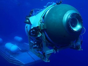 This undated image courtesy of OceanGate Expeditions, shows their Titan submersible launching from a platform. Rescue teams expanded their search underwater on June 20, 2023, as they raced against time to find a Titan deep-diving tourist submersible that went missing near the wreck of the Titanic with five people on board and limited oxygen. All communication was lost with the 21-foot (6.5-meter) Titan craft during a descent June 18 to the Titanic, which sits at a depth of crushing pressure more than two miles (nearly four kilometers) below the surface of the North Atlantic.