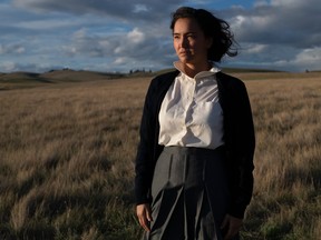 Picture of Grace Dove standing in a field while starring in Bones of Crows.