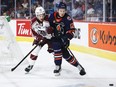 Peterborough Petes forward J.R. Avon, left, and Kamloops Blazers defenceman Ryan Michael battle for the puck during first period Memorial Cup hockey action in Kamloops, B.C., Thursday, June 1, 2023.THE CANADIAN PRESS/Jeff McIntosh
