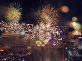 FILE - Fireworks explode over the Las Vegas Strip during a New Year's Eve celebration Jan 1, 2023, in Las Vegas. Tens of thousands of Vegas Golden Knights fans, maybe more, are expected at the heart of the Las Vegas Strip on Saturday for a Stanley Cup victory parade and a rally to mark the team's first-ever NHL championship. Las Vegas police prepared Friday for upwards of 100,000 people to cram viewing areas along Las Vegas Boulevard for a celebration that planners were comparing to annual New Year's Eve fireworks shows.