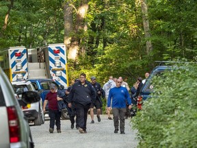 FILE - Search and rescue teams leave the command post at St. Mary's Wilderness en route to the Blue Ridge Parkway to search for the site where a Cessna Citation crashed over mountainous terrain near Montebello, Va., Sunday, June 4, 2023. An unresponsive business jet that flew off course and over the nation's capital plunged into a Virginia mountain at a "high velocity" and in a "near-vertical descent," according to a federal report released Wednesday, June 21, 2023.