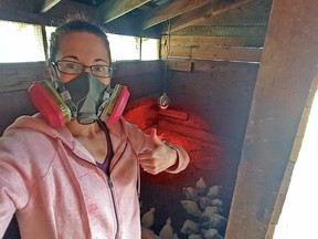 Shannon Briggs, who has mild asthma, regularly wears a respirator to do outdoor chores on her family's farm near Sayward on Vancouver Island. Here she takes a selfie in her chicken coop.