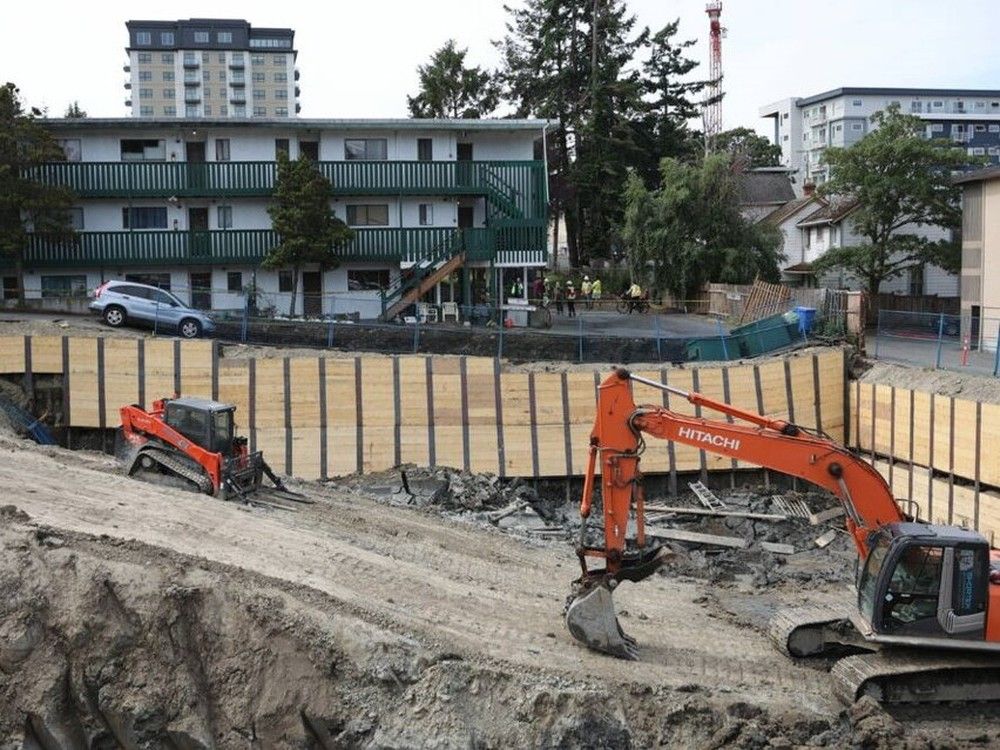 About 30 residents of two Esquimalt apartment buildings were evacuated Tuesday morning after a driveway next to an excavation site collapsed. June 13, 2023. Photo: Darren Stone. 