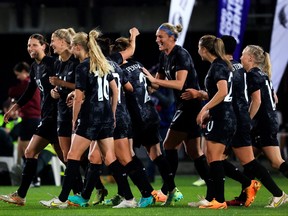 New Zealand players celebrate a goal during the women's international friendly football match against Vietnam.
