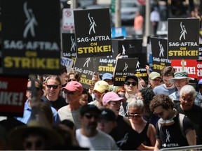 The Screen Actors Guild ? American Federation of Television and Radio Artists (SAG?AFTRA) workers and their supporters march and hold a rally to draw attention to their demands in downtown on July 20, 2023 in Chicago, Illinois.