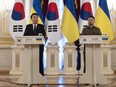 South Korean President Yoon Suk Yeol, left, delivers a statement as Ukrainian President Volodymyr Zelenskyy listens during his surprise visit in Kyiv, Ukraine, Saturday, July 15, 2023.