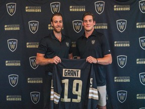 Vancouver Warriors governor Dax Aquilini (left) and presents rookie defender Owen Grant with his first jersey this weekend.