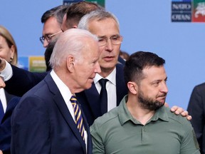 Ukrainian President Volodymyr Zelensky and U.S. President Joe Biden arrive for a working session on Ukraine at the NATO summit, in Vilnius on July 12, 2023. (Photo by LUDOVIC MARIN/AFP via Getty Images)