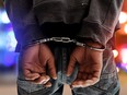 This illustration shows a man in handcuffs.