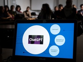 Teachers are seen behind a laptop during a workshop on ChatGpt bot organised for by the School Media Service (SEM) of the Public education of the Swiss canton of Geneva, on February 1, 2023.